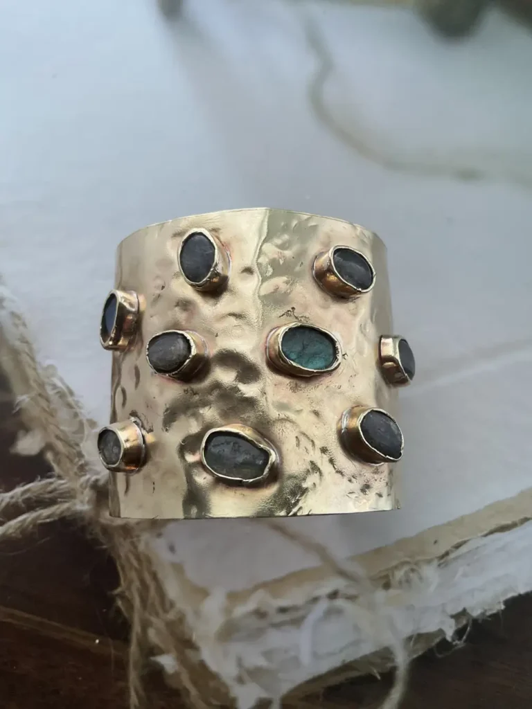 Raw labradorite gemstone cuff bracelet in hammered gold, front detail