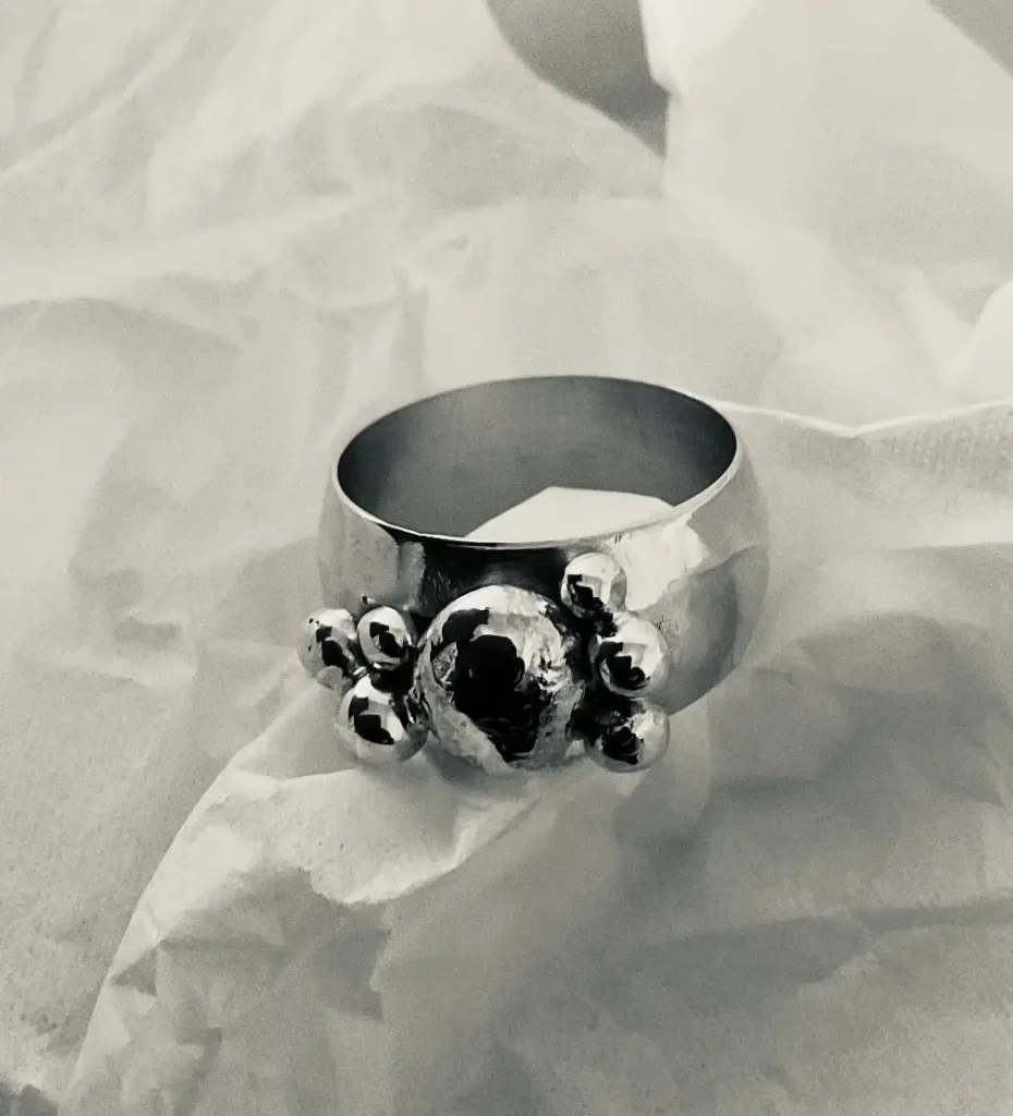 Handmade brass statement ring with sterling silver granulated bead cluster, black and white filter